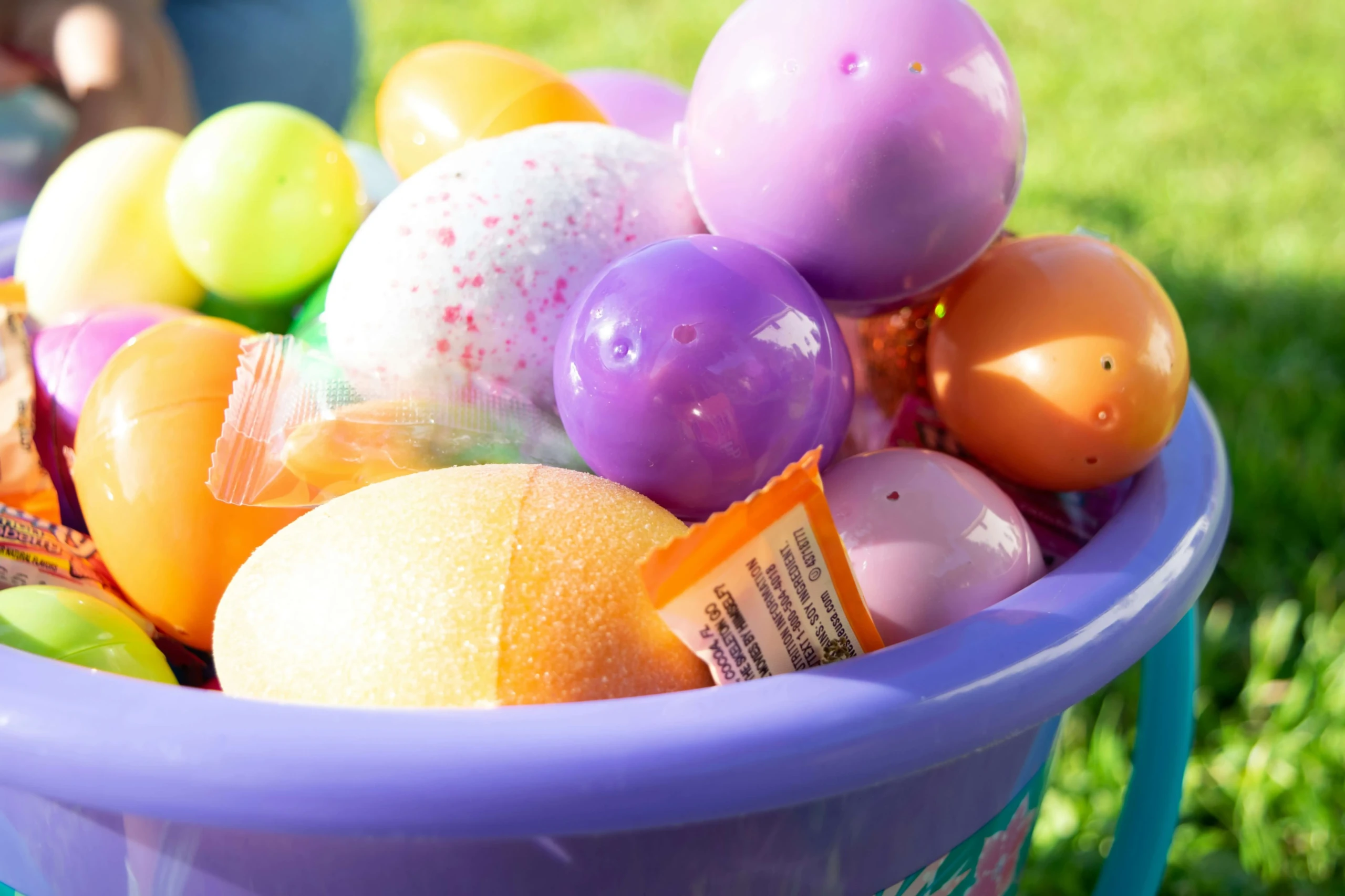 Colorful Easter eggs in a purple basket