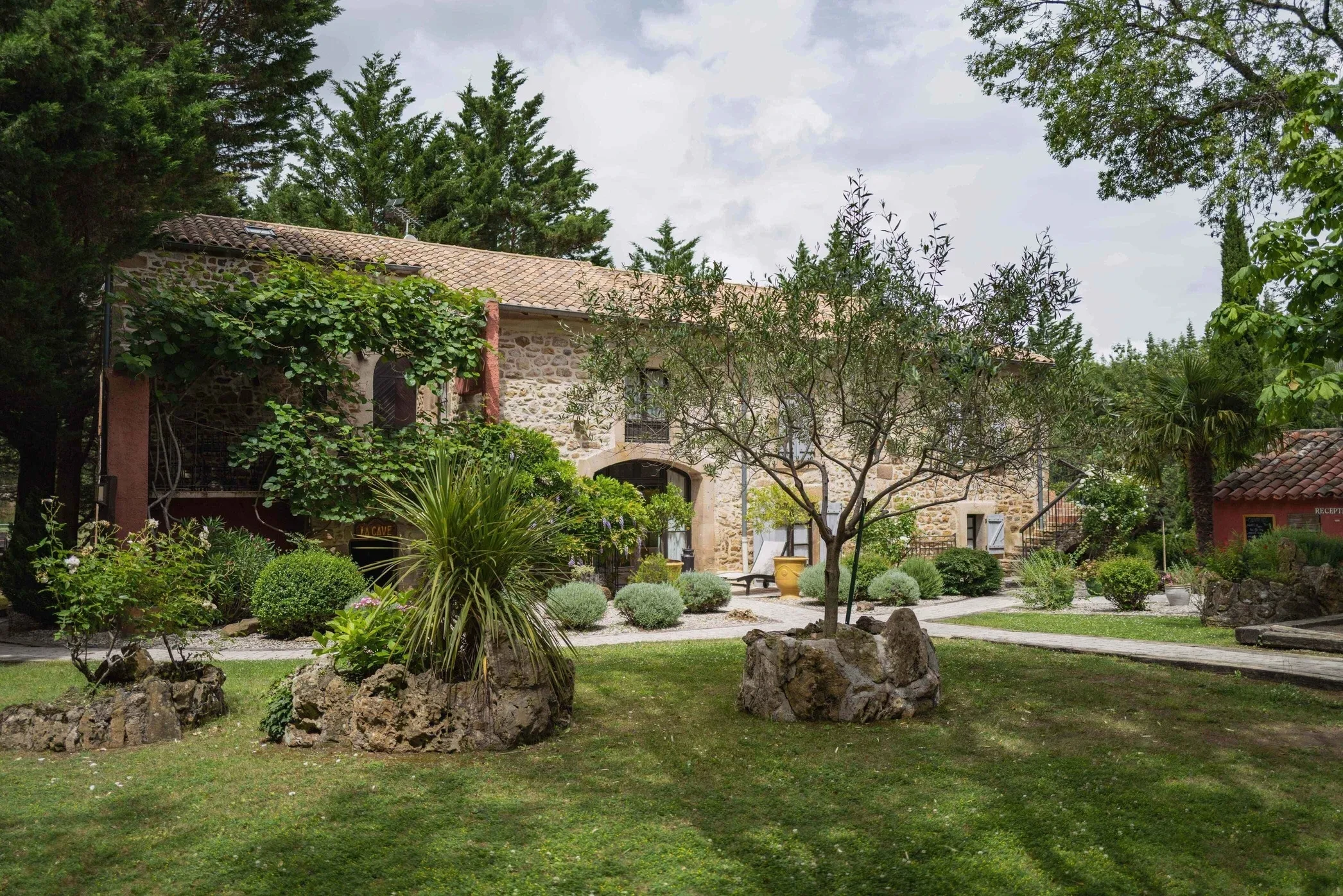 Rustic house with lush garden and trees